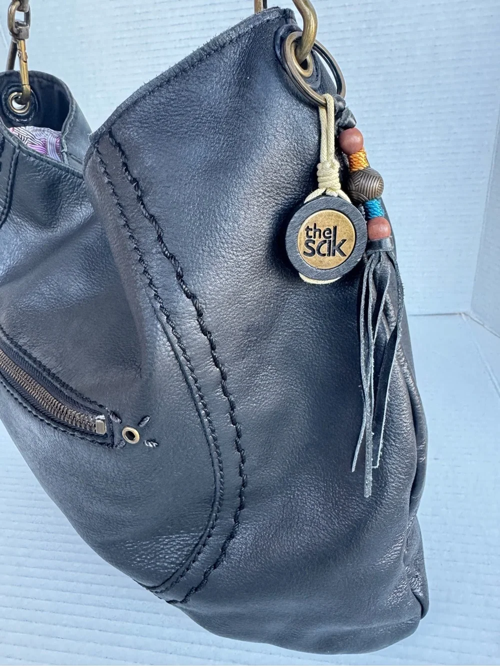 The Sak Black Leather Hobo Bag Braided Strap & Tassel Charm